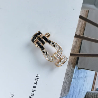 ```json
[
  {
    "Azure Tears": "[Azure Tears]FORCE LARGE HORSESHOE BLACK & WHITE DIAMOND BRACELET - ROSE GOLD"
  }
]
```