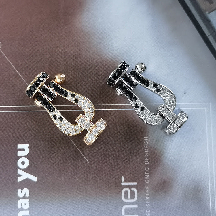 ```json
[
  {
    "Azure Tears": "[Azure Tears]FORCE LARGE HORSESHOE BLACK & WHITE DIAMOND BRACELET - ROSE GOLD"
  }
]
```